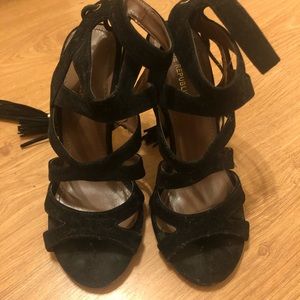 Black high heels with tassel decor